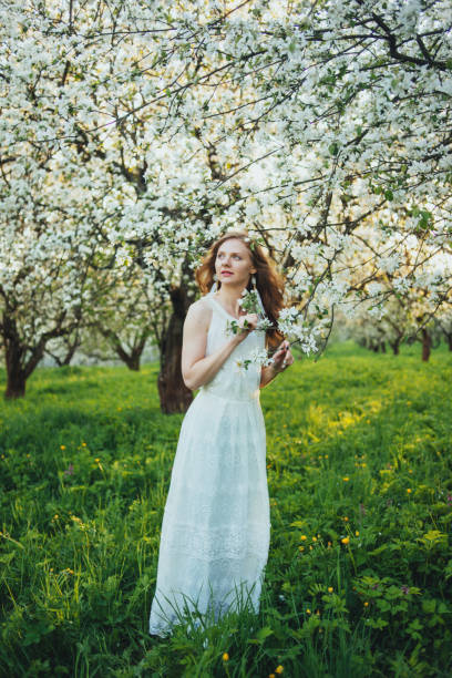 istock A girl in an apple orchard 674749800