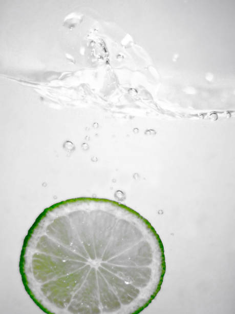 istock Hey fresh and cool lime fruites jumping in cold water. 674749876
