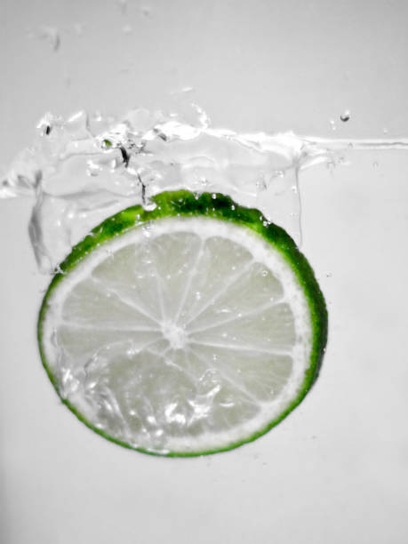 istock Hey fresh and cool lime fruites jumping in cold water. 674749946