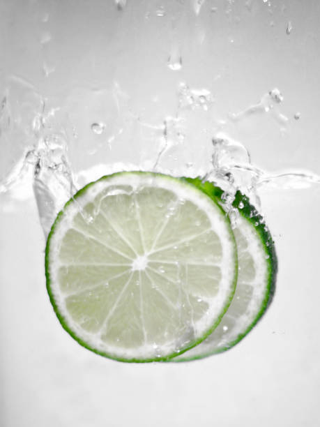 istock Hey fresh and cool lime fruites jumping in cold water. 674750048