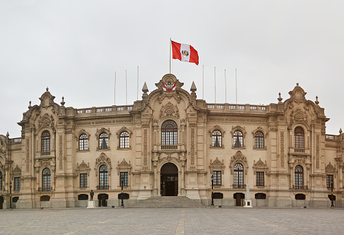 Lima, Peru - April 24, 2017: President palace in Peru Lima with big flag on top.