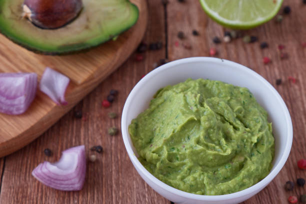 istock Traditional mexican guacamole sauce with avocado 674765564