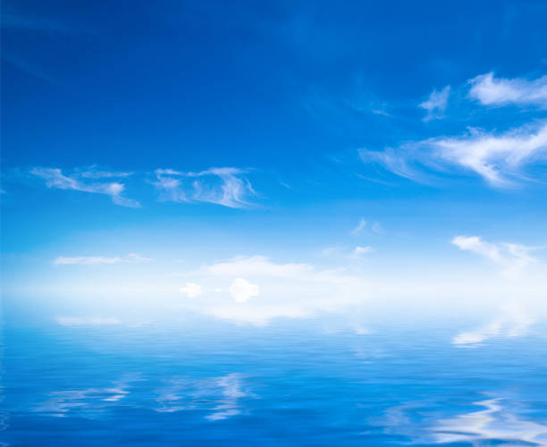 istock white fluffy clouds with rainbow in the blue sky 674765944