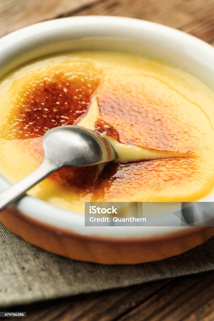 Creme Brulee (Catalan cream) Creme Brulee (crema catalana) and spoon Creme Brulee Stock Photo