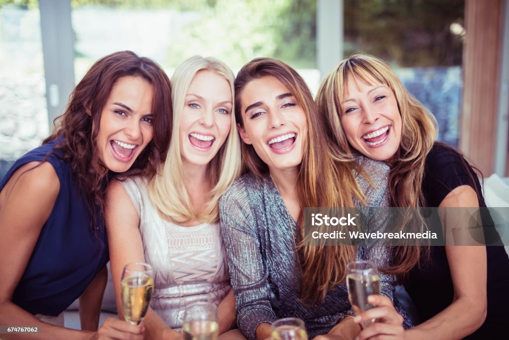 Portrait of beautiful women having drink Portrait of beautiful women smiling and having drinks at the party Party - Social Event Stock Photo