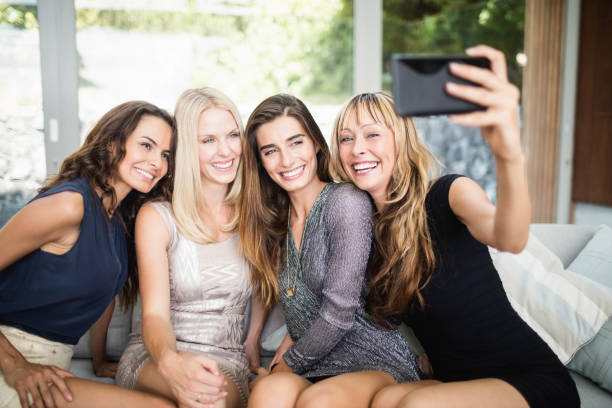 istock Beautiful women taking selfie with mobile phone 674767142