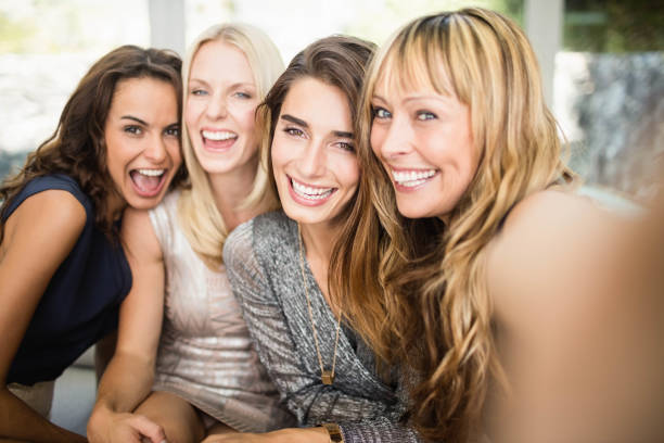 Group of beautiful women having fun Portrait of beautiful women having fun at party 30 39 years photos stock pictures, royalty-free photos & images
