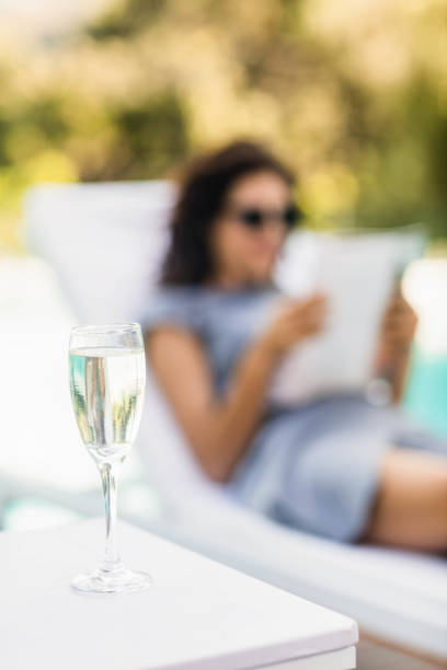 istock Close-up of champagne flute on side table 674769592