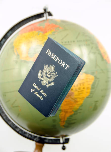 istock American passport with world globe behind it 674772452