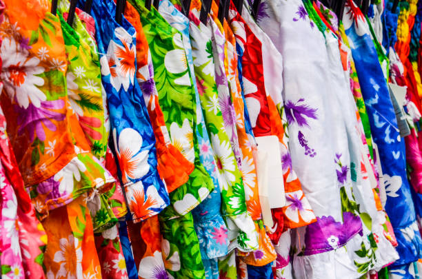 istock Closeup of different colored pattern fabrics or dresses on display in store 674772506