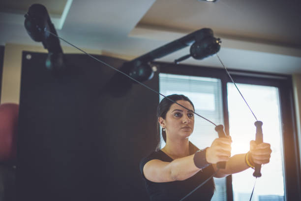 istock Woman exercising at the gym 674781876