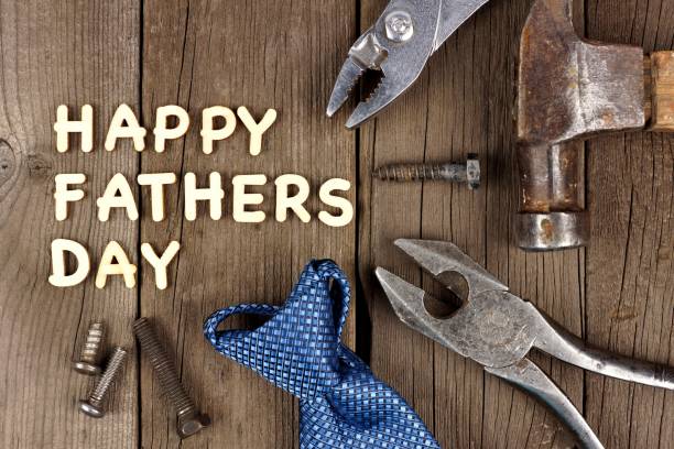 istock Happy Fathers Day wood letter greeting with tools and tie 674782422