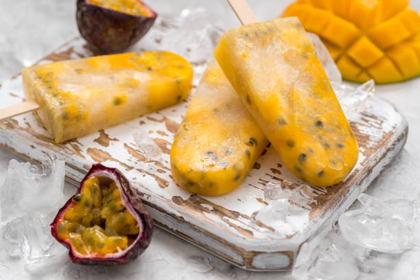 istock Homemade frozen popsicles with fresh mango and passion fruit 674792674