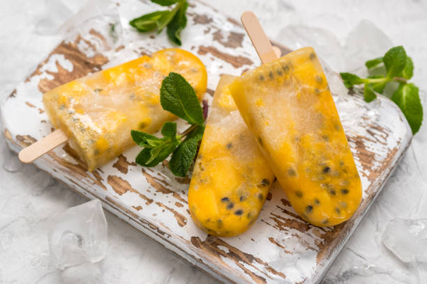 istock Homemade frozen popsicles with fresh mango and passion fruit 674792698