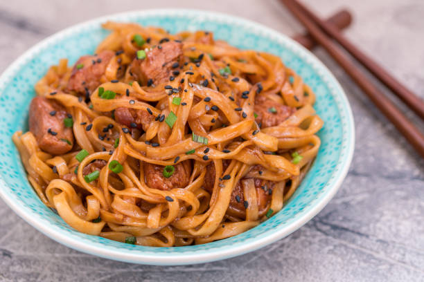 istock Stir Fried noodle with pork in soy sauced 674792886