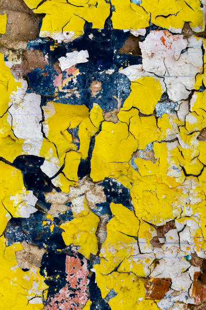 istock Plaster wall with yellow peeling paint, Pushkar, Rajasthan, India 674796342