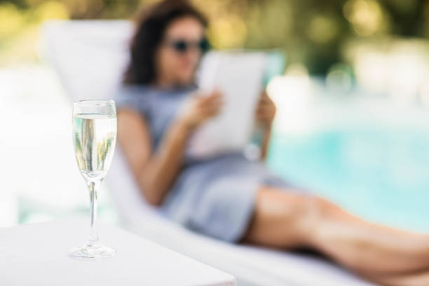 istock Close-up of champagne flute on side table 674803174