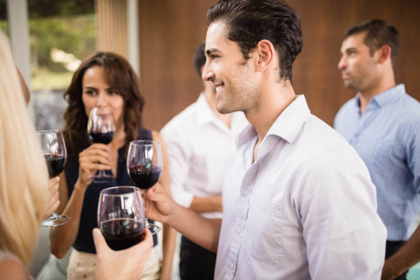 istock Group of friends having wine 674803992