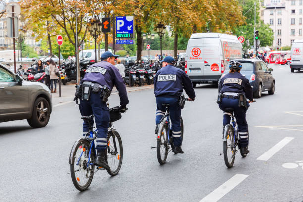 Zurich, Switzerland - 13 April, 2015: police bicyclists on Bahnhofstrasse street during the Sechselauten parade. The Sechselauten is a traditional spring holiday in the city of Zurich.