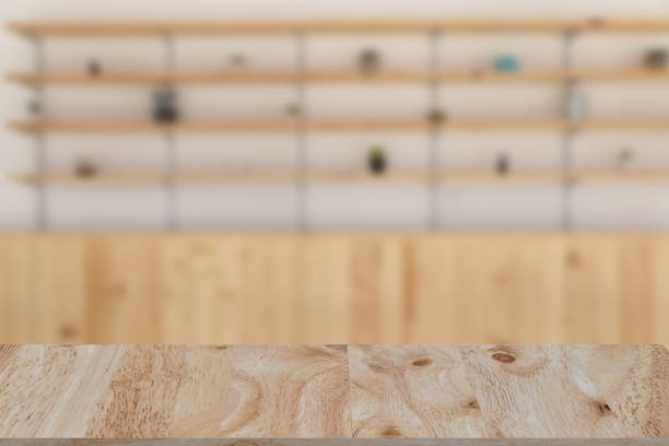 istock restaurant or coffee shop blur background with selected focus wood table for montage or display your product 674807202