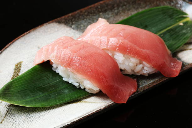 istock tuna sushi set on black background 674828192