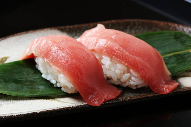 istock tuna sushi set on black background 674830470
