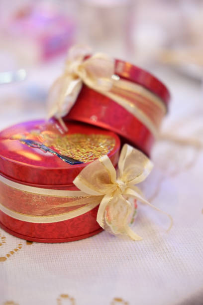 istock Beautiful wedding favors wrapped in cute boxes, red box 674838978