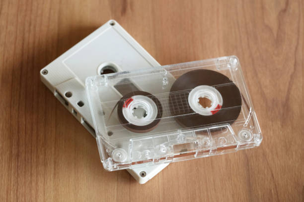 istock Cassette tape on wooden  background 674839668