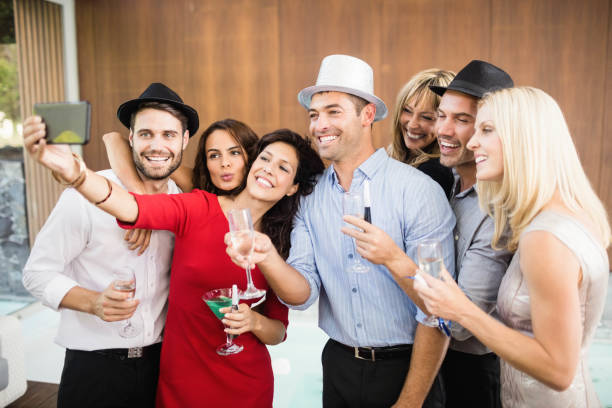 istock Group of friends taking selfie 674842118