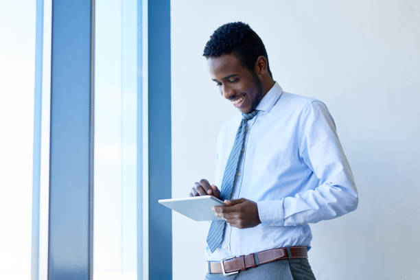 istock Excited African businessman with tablet 674853482