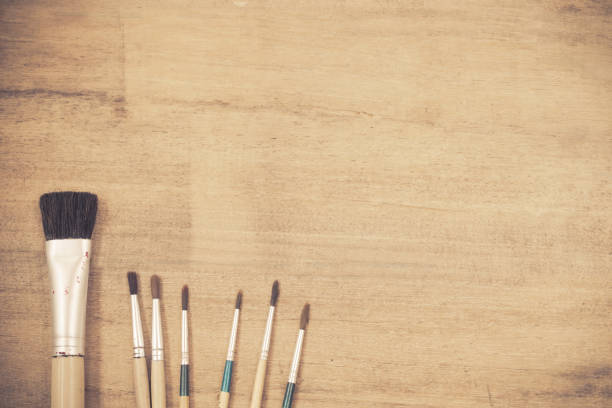 istock paint brush and color on wood 674854474