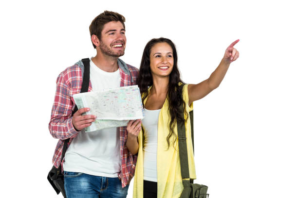 istock Happy couple holding map and pointing somewhere 674857646