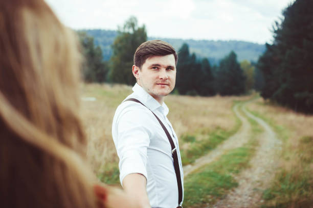 istock the lovers are standing on a forest road 674863856