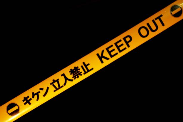 istock Yellow and Black WARNING Barrier Tape Background 674864182