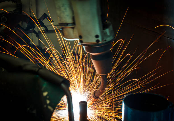 istock Welding robots movement in a car factory 674874078