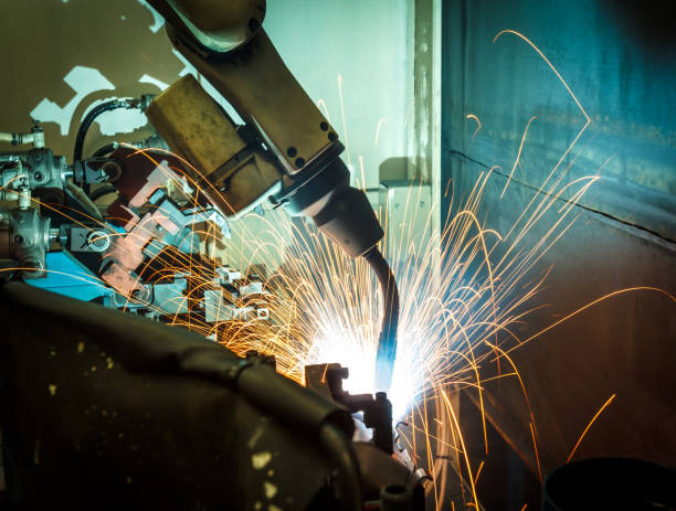istock Welding robots movement in a car factory 674881396