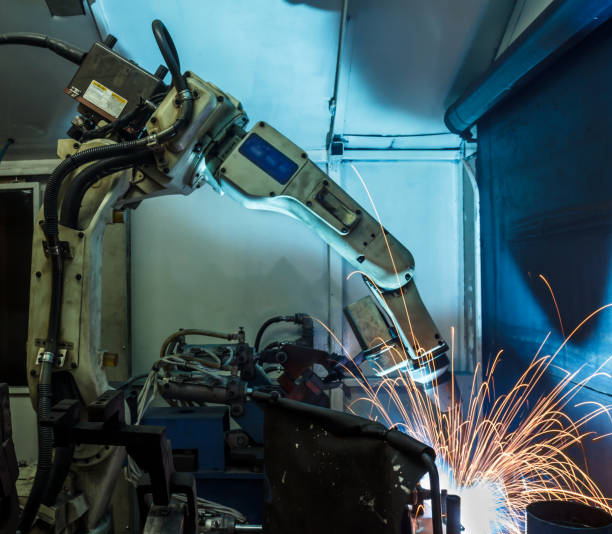 istock Welding robots movement in a car factory 674881942
