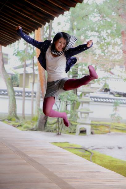 istock Young Japanese lady at Japanese temple 674884940