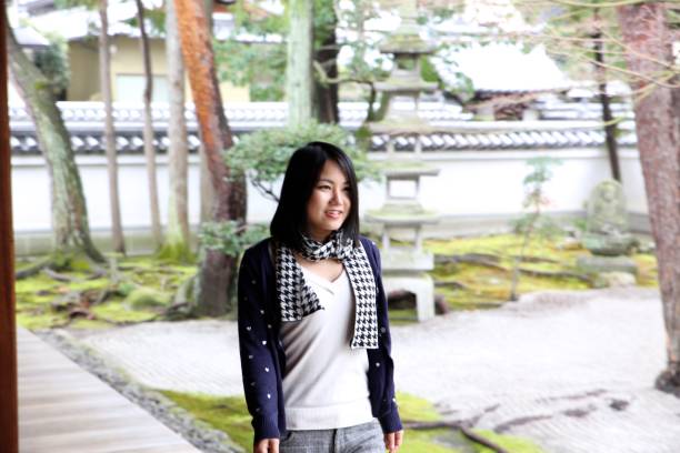 istock Young Japanese lady at Japanese temple 674885258