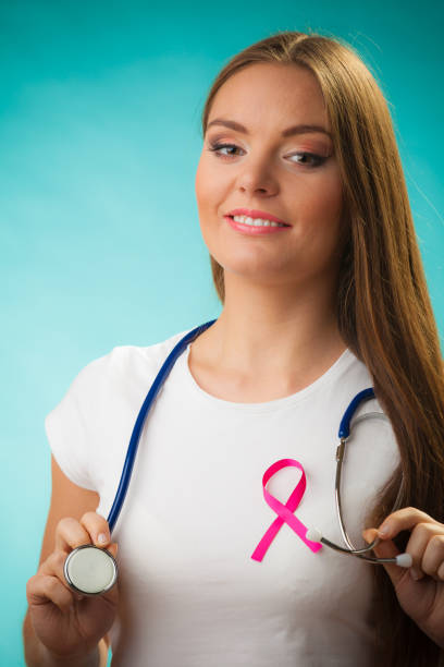 istock Doctor with ribbon formed Aids symbol isolated 674889358