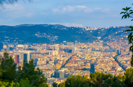 Barcelona's cityscape from Montjuïc mountain. April morning with thermal inversion, and clouds ove the sky.