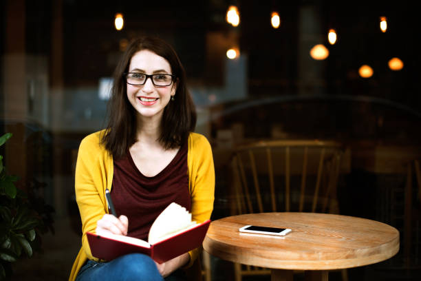 istock Woman Reading Studying Cafe Restaurant Relaxation Concept 674901936