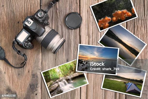 Old Camera And Photos On Vintage Wooden Background Stock Photo - Download Image Now - Photography, Photographic Print, Camera - Photographic Equipment