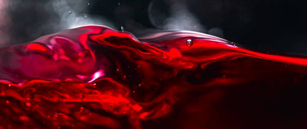 Red wine on black background stock photo