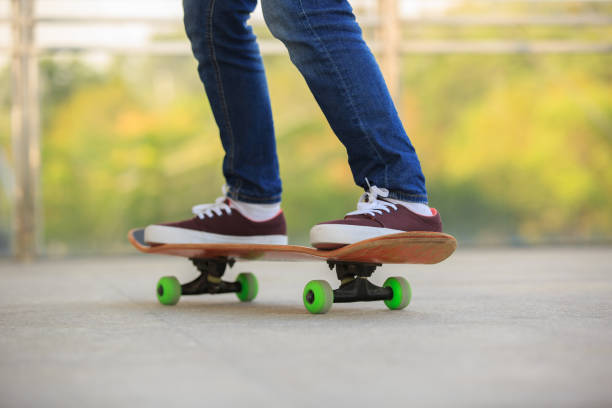 istock skateboarder legs skateboarding at skatepark 674902686