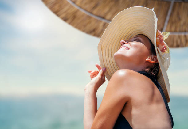 istock Woman in big straw hat enjoyed with summer sun 674906644