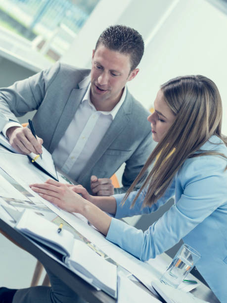 istock Two colleagues having a meeting in an office 674912662