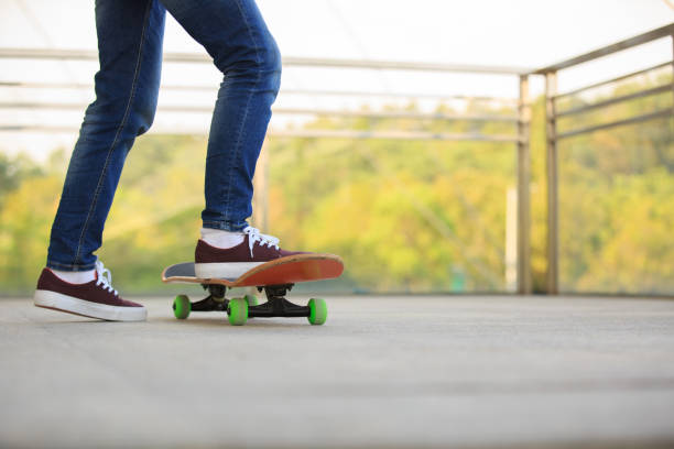 istock skateboarder legs skateboarding at skatepark 674912838