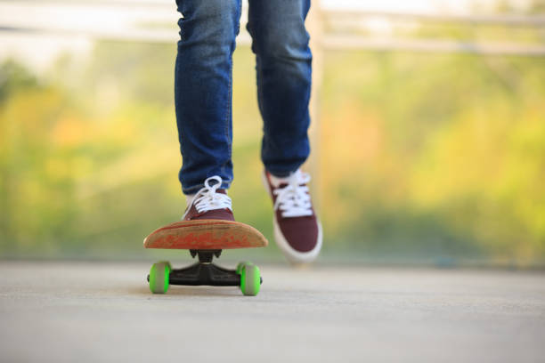 istock skateboarder legs skateboarding at skatepark 674913182