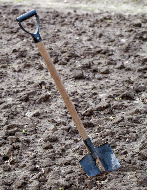 istock Garden spade in soil 674913512